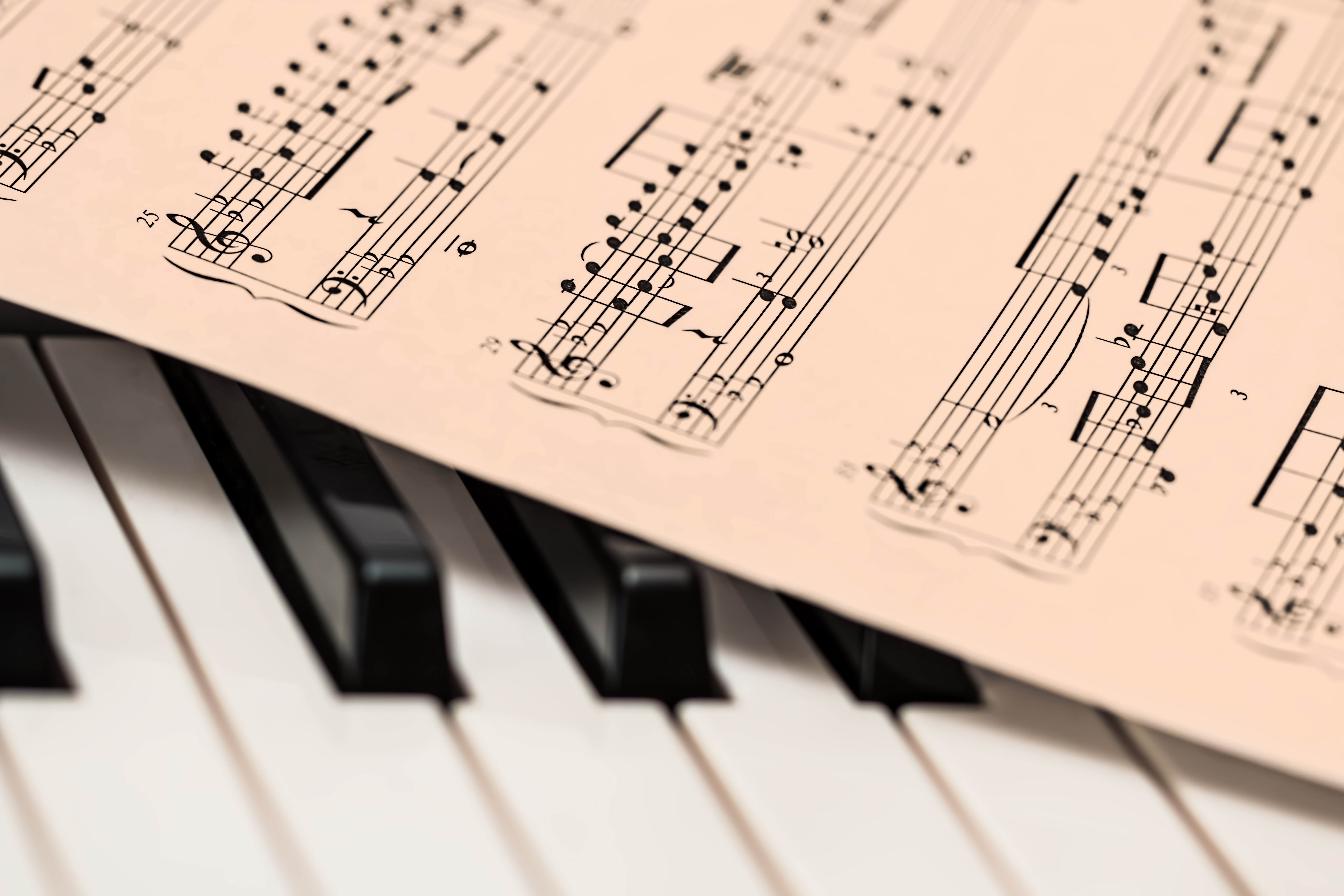 Piano keyboard and sheet music